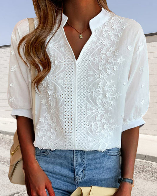 Blouse with V-neckline, puff sleeves, and lace detailing