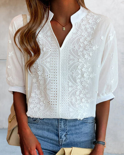 Blouse with V-neckline, puff sleeves, and lace detailing